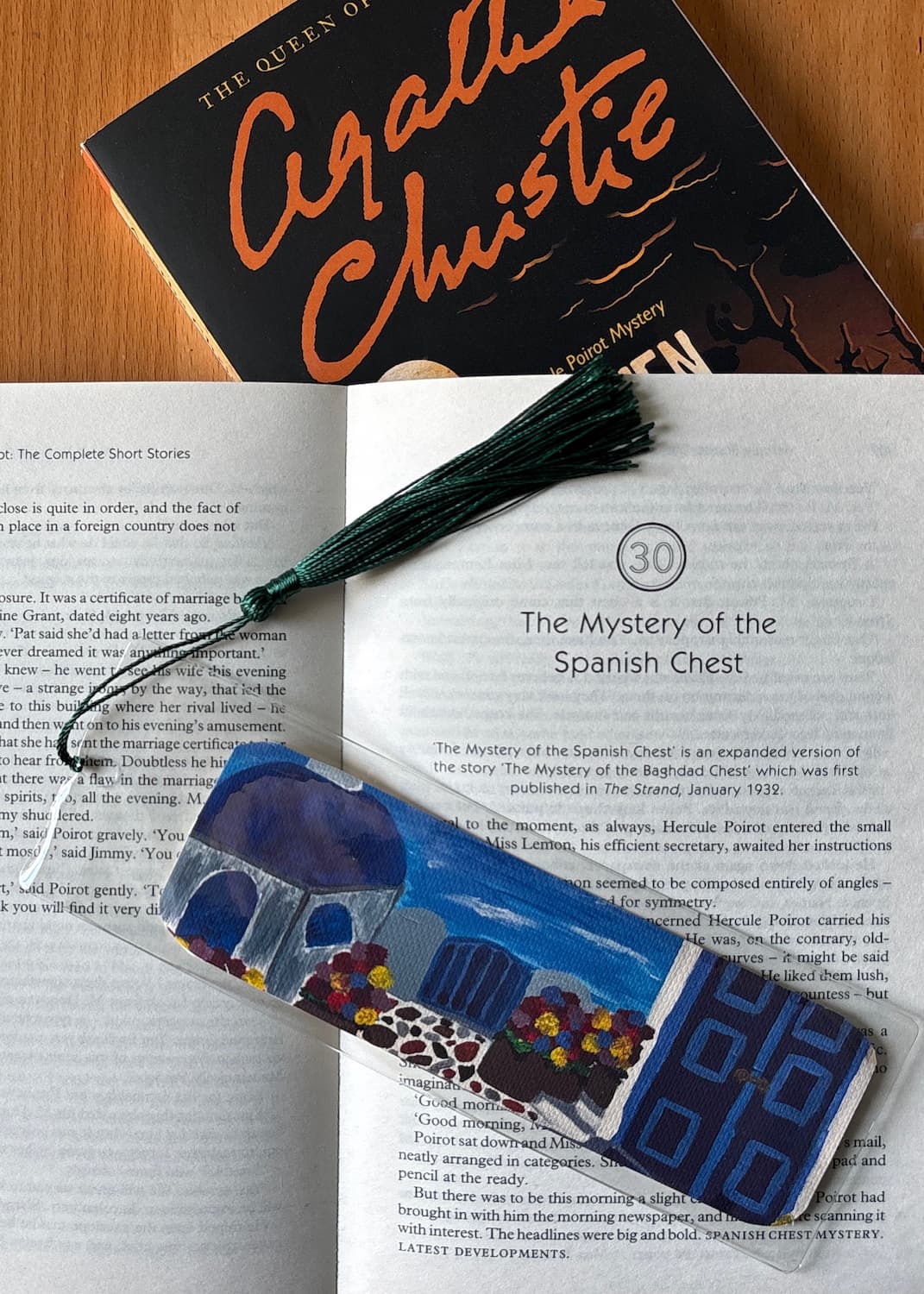 Santorini Villa bookmark staged with a book