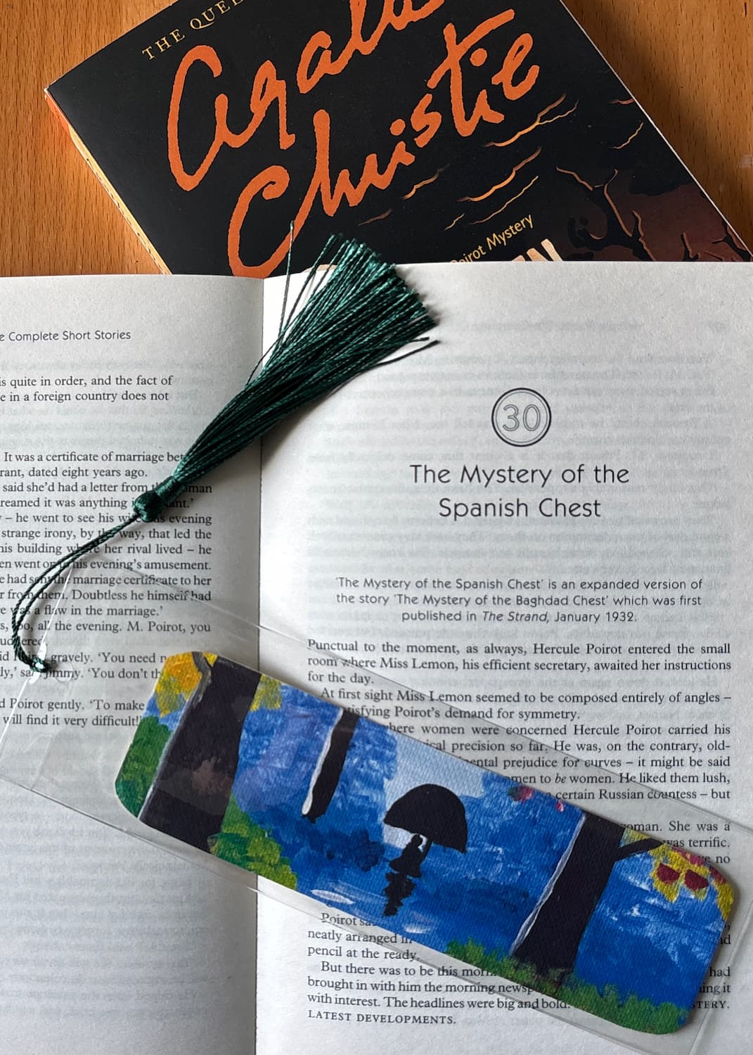 Walking in the Rain bookmark staged with a book